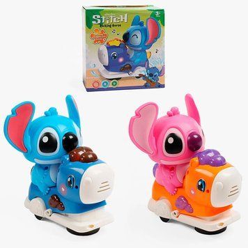 Музыкальная игрушка Стич 328-8 с подсветкой и колесом свободного хода, 2 цвета 191802 фото &mdash; Кузя